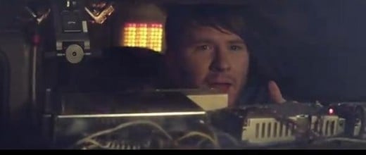 He rides in the actual car from 'Back to the Future'.