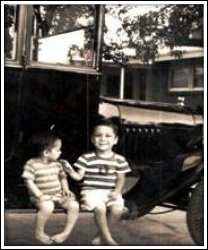 The author, left and older brother sitting on Uncle's 1921 Model T