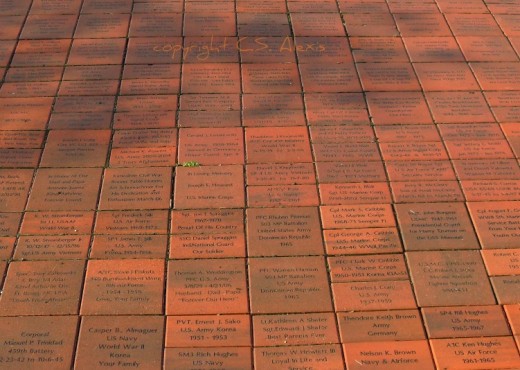 A commemorative brick pathway leads visitors on a tour through the history of US Veterans from the 20th Century. Too many bricks honor those fallen soldiers who made the ultimate sacrifice.