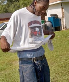 This dude covers his ass with a shirt. Still illegal.