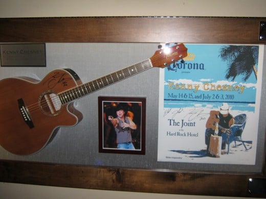 Kenny Chesney's exhibit, includes a signed guitar.