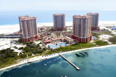 Aerial photo of the five towers of Portofino Resort. Pensacola Beach, Florida. Photo taken above Pensacola Bay, facing towards the Gulf of Mexico.