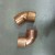 These are standard Copper Angle Fittings. Notice the top one is at a 45 degree angle and the bottom is @ 90 degrees. These are the 2 most basic but there are several other angles and varieties.
