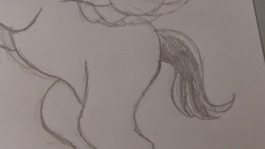 Shade the Pony tail and darken some more pencil lines.