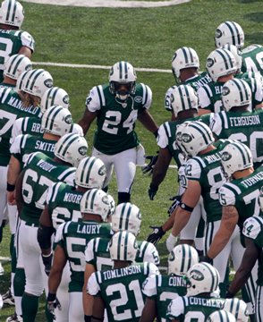 Revis Leads the Jets in the huddle 