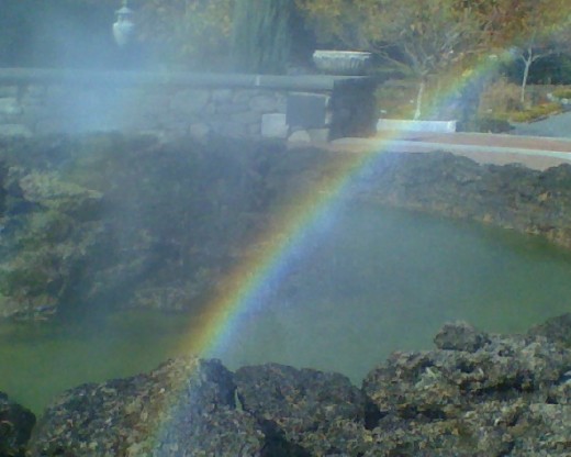 Rainbow in the primordial pool fountain at Tower Hill Botanical Garden