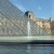 A fountain next to the Louvre Pyramid