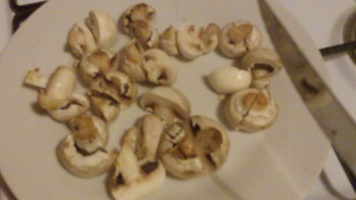 Cut the mushrooms in half.