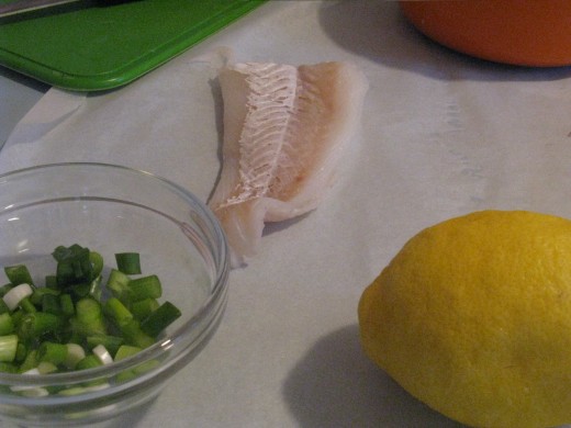 Preparing Fish to cook en papillote in the microwave.