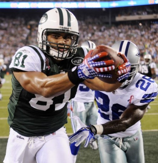 Dustin Keller raises his red, white and blue commemorative 9/11 gloves to the crowd after he pulls in a 4 yd TD - Jets win over Dallas Cowboys 27-24