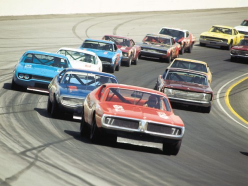 STOCK CAR RACES ARE NOW A BOOMING INDUSTRY IN THE SOUTH. THIS BUSINESS STARTED FROM A HANDFUL OF GUYS WHO HAULED MOONSHINE FOR A LIVING.