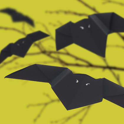 Bats can be made of black paper origami-like and hung on the ceiling
