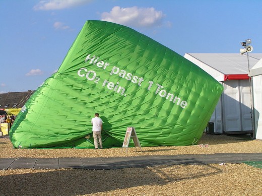 Climate protesters struggle:  a sagging illustration of the volume of 1 tonne of CO2.  Image karsten11 and Wikimedia Commons.