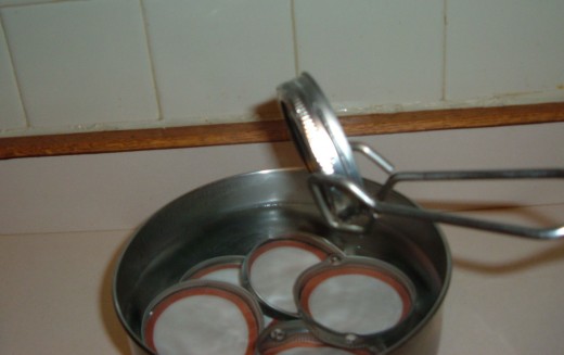 Put lids in a metal or glass bowl (not plastic) and fill with boiling water.
