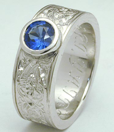 Platinum ring w/ bezel-set sapphire