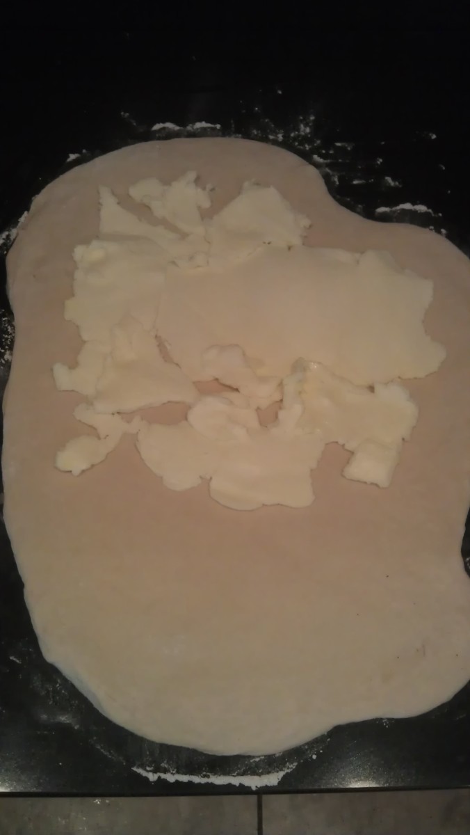 Place the smashed-out butter in the top two-thirds of the dough square.