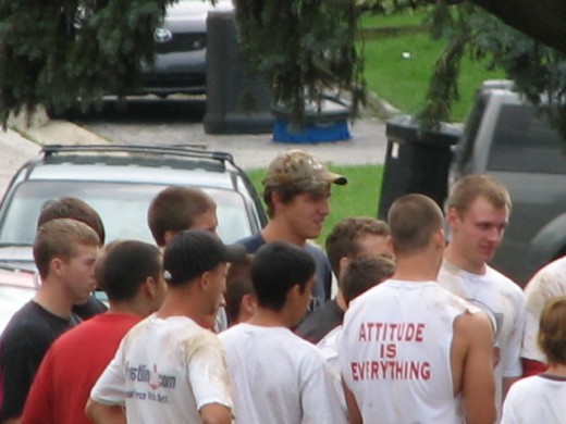 The Munster High School Football Team Huddle For Sandbagging Instructions