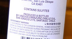 Look at the labeling on the bottle to see if there are any added sulfites.
