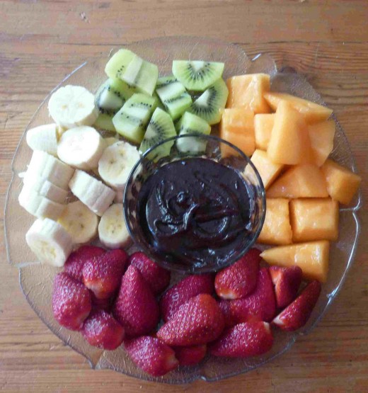 Chopped fruit with dipping sauce.
