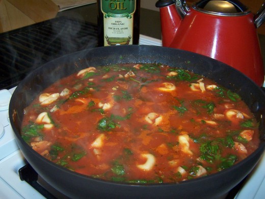 When the spinach wilts, the soup is done. You can either eat it now or simmer to eat later.