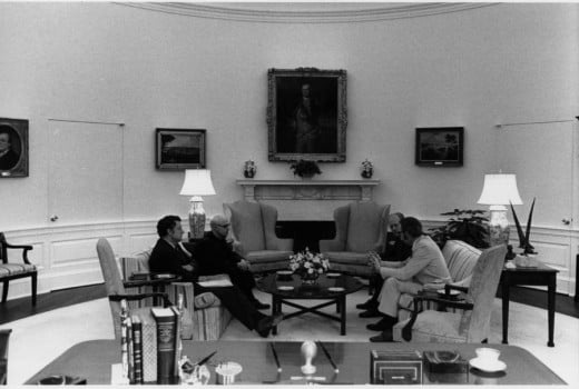 President Ford discusses the evacuation of Saigon with national security advisers Henry Kissinger and Brent Scowcroft during an evening meeting in the White House