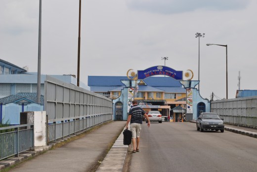 The border Thailand and Malaysia.  Walking across the Harmony Bridge.