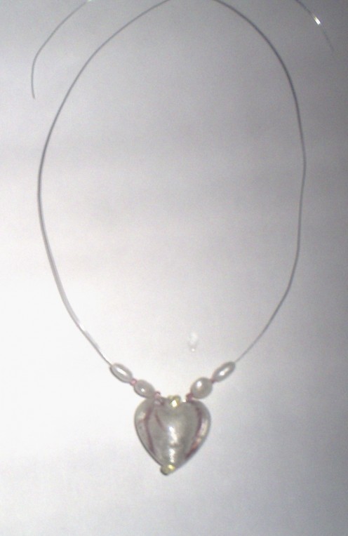 Start out the pattern with a fake pearl bead, and then add a pink seed bead.  Repeat this pattern on each side of the necklace.