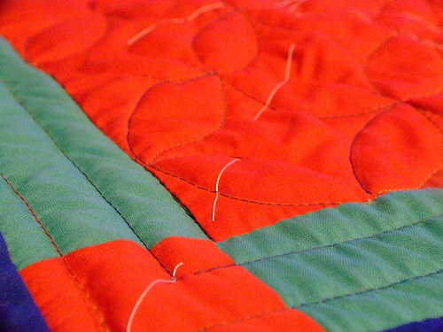 Machine guided quilting is stitched with feed dogs up and is best for straight lines or gentle curves.