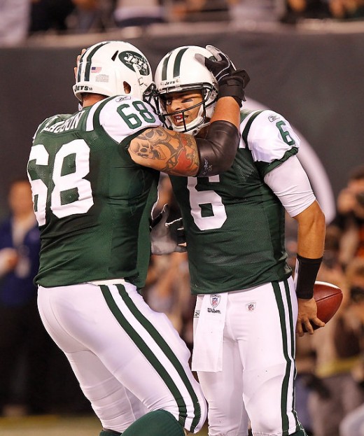 The Jets' Matt Slauson congratulates Mark Sanchez after his touchdown run in the 2nd quarter. 