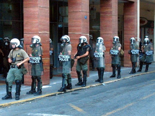 Men of the greek riot police (MAT) on standby for crackdown of an anarchist solidarity demonstration