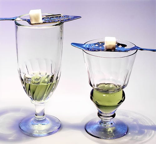 Two absinthe glasses. Left, Swirl glass. Right Pontarlier reservoir glass.