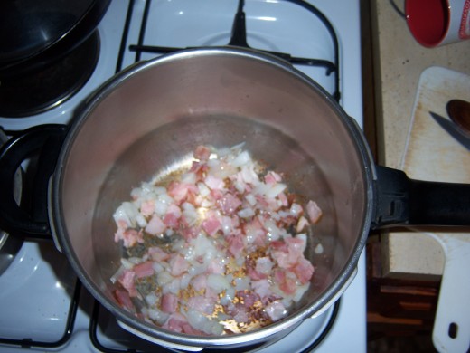 Fry the chopped bacon and onion together.