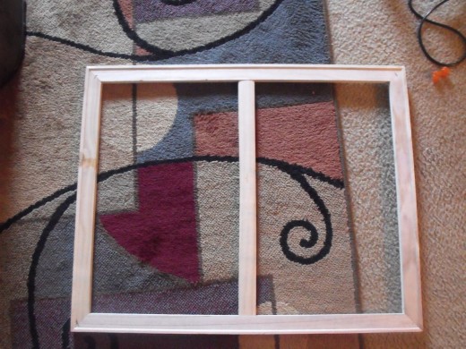 Step 1:  Canvas frame is behind all canvas.  These are actually 2 canvas frames I took apart to make one.  The center wood came from a piece of the frames I took apart.  Look around your house.  You may not need to buy one.