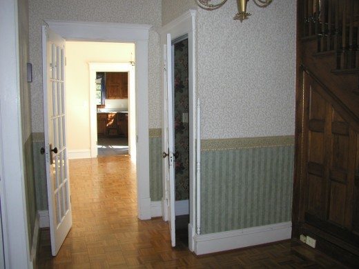 Looking from entry way to dining room to kitchen
