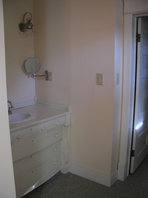 Updated but fitting master bath using built in old chest of drawers as sink
