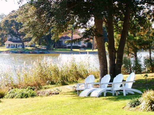 This grouping of chairs overlooks the lake and a cluster of gazebos. 