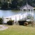 Example of gazebo with winding pathway leading to it and a lovely garden beside the entry gate. 