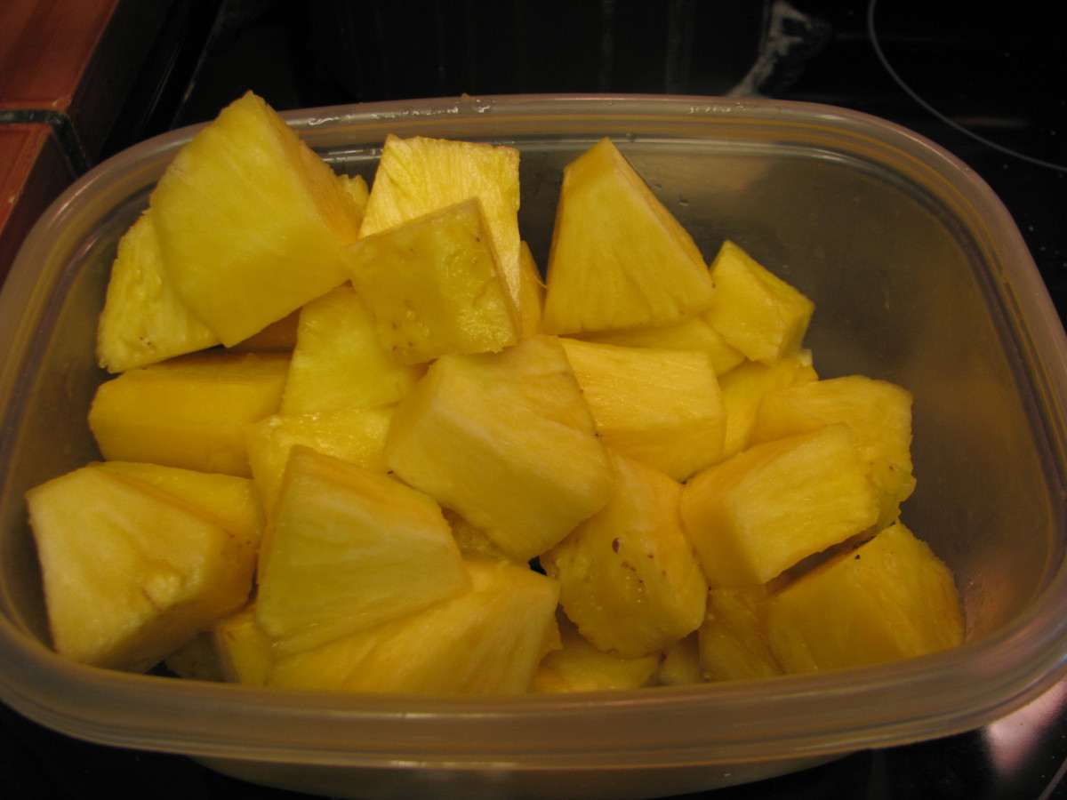 Cut 1/2 fresh pineapple (or one can of pineapple chunks) To cut fresh pineapple: Cut off top and bottom of fresh pineapple.  Slice in half and then quarters.  Cut out  core and then slice each quarter in three.  Cut chunks.