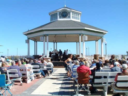 Rehoboth Beach Bandstand is approximately a 1/2 mile north of Silver Lake. If one walks to the south end of the boardwalk and turns right they will see the lake straight ahead. 