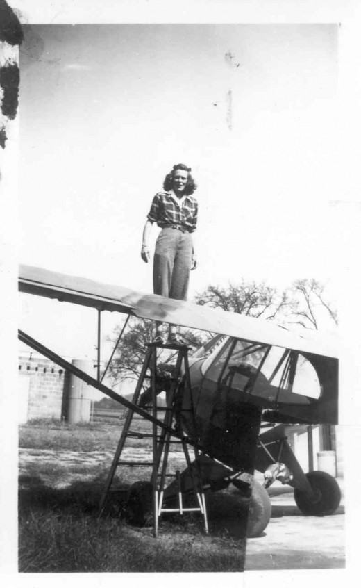 Mary Barnard working on Piper Cub