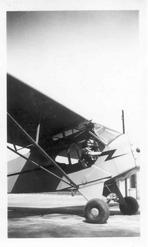 Mary in the Piper Cub.