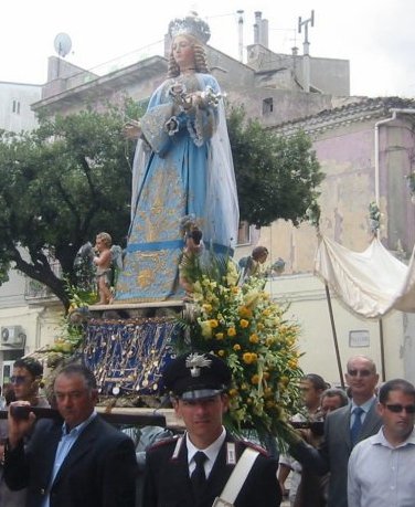 This is the statue of the Madonna that we carry in a procession in Genzano, I've carried the statue myself when I was in Genzano. Strange as it may seem the woman I have fallen in love with resembles this Madonna. Is this God's religious link for me?