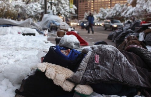 Protesters sleeping on snowny sidewalk in Denver, Colorado. They continue their protests even in the winter snowstorm and freezing night-time temperatures.