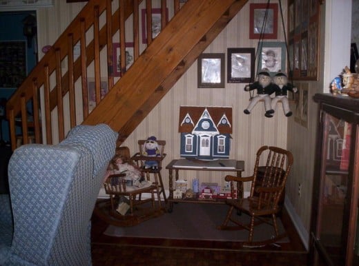 This photo shows the doll house my children and I made.  Those high chairs are antiques.