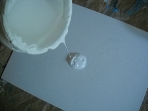 Pouring gesso.