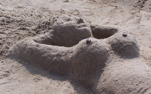 Even this sand mermaid seems to be a victim of The bigger the better notion