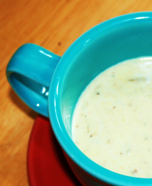 Enjoy warm crab soup from a colorful Fiestaware mug.