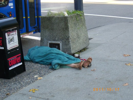 One of the reasons why Occupy Vancouver is present because of a lack of action on homelessness and broken promises going back 30 years, This man was photographed on a street intersection far from the occupation.