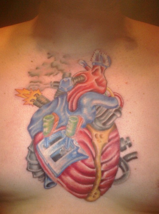 Joey Kaylor's "Mechanical Heart" tattoo, made by Mike Truitt. Joey had to tie off his long beard so that it was out of the artist's way while he was working. 