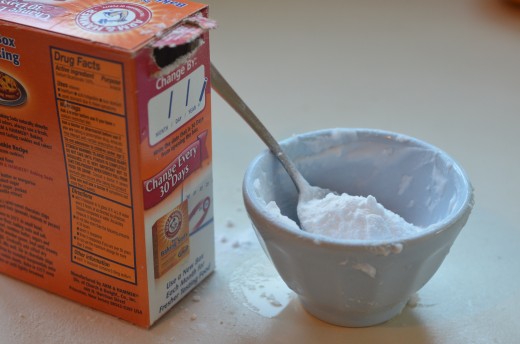Mix water with baking soda to make a simple paste that will make all that bad stuff go away... eventually.